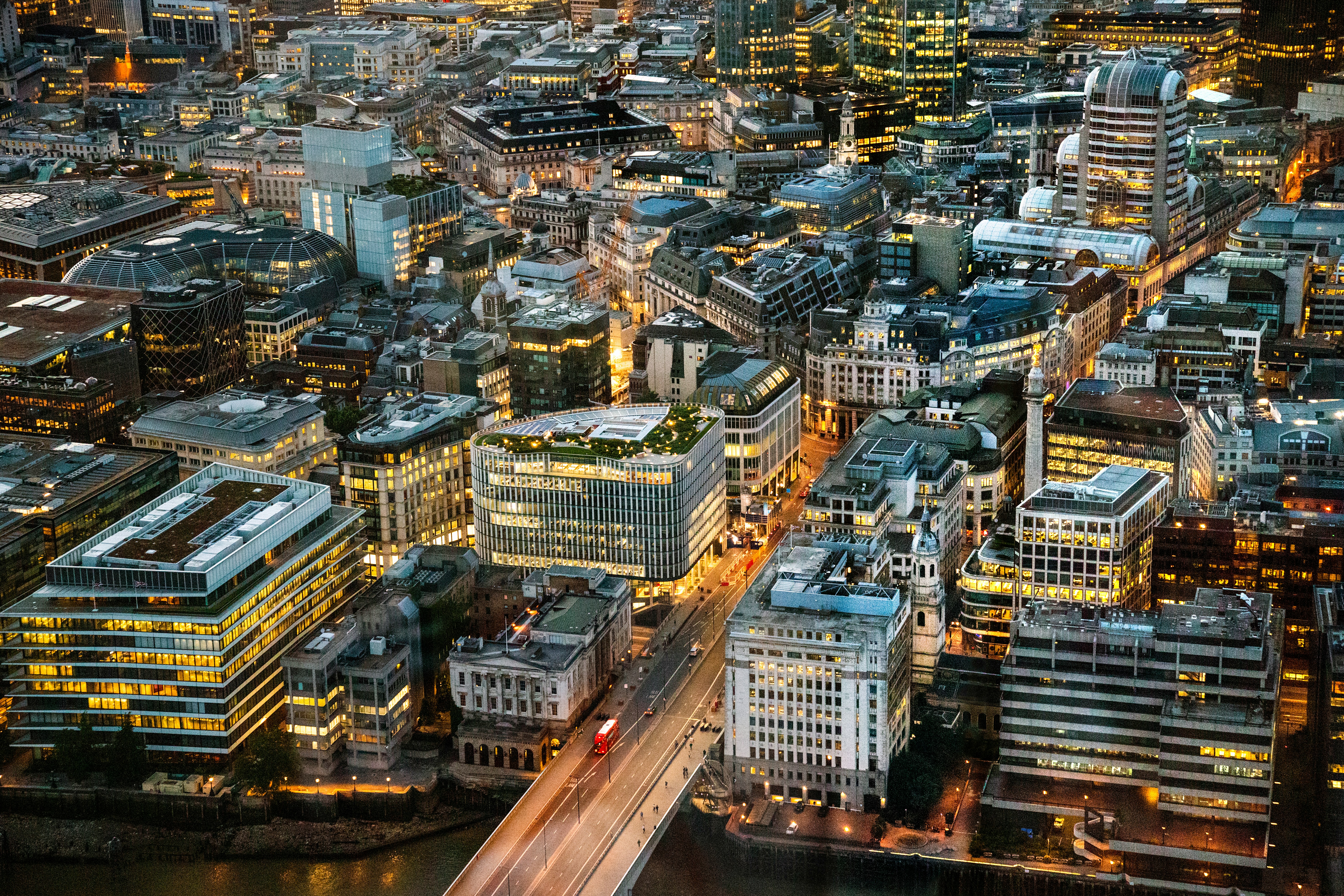 Aerial view of a city business district lit up at dusk